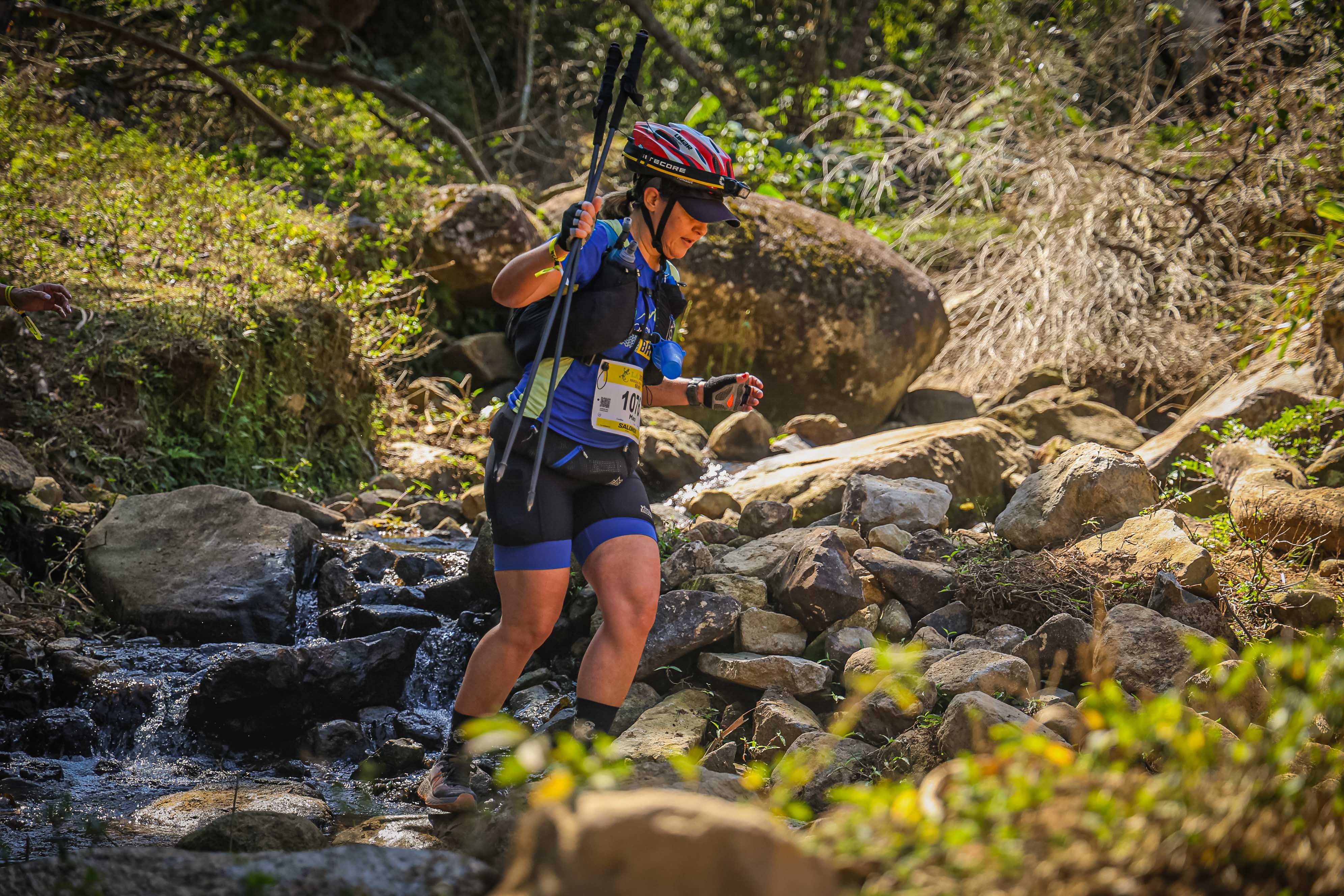 Mara running a trail race
